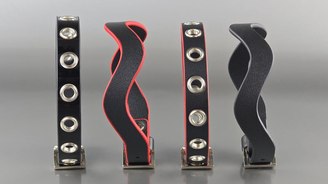Row of black and red leather day collars with silver O-rings and buckle hardware